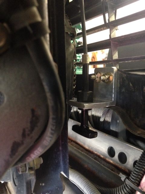 1987 Suzuki Samurai - Aftermarket hood latch mechanism installed on a vehicle's front end.