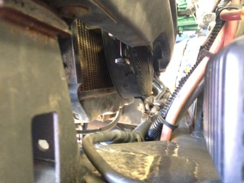 1987 Suzuki Samurai - View of the engine bay focusing on the radiator and surrounding components.