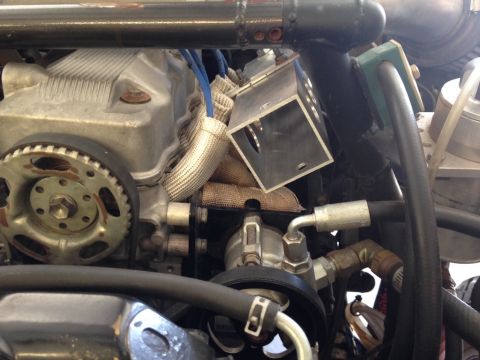 1987 Suzuki Samurai - Close-up view of an engine bay, showing various mechanical components and wiring.