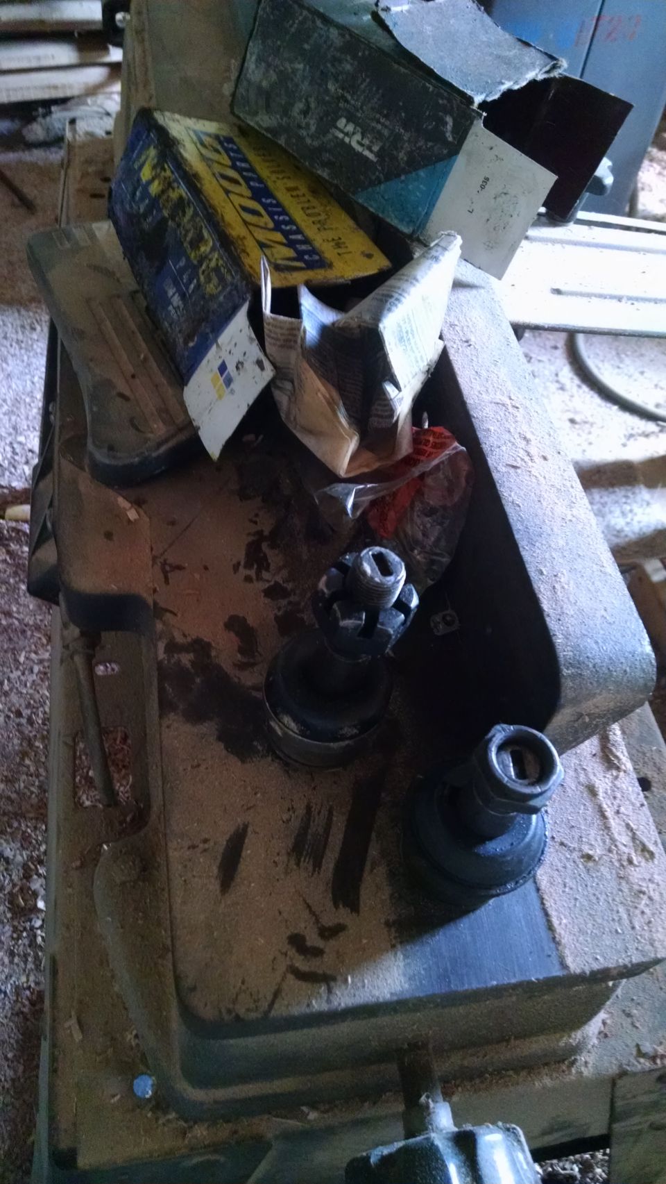 Machine parts and boxes on a workbench