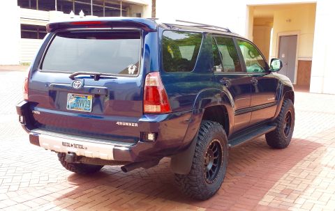 2005 Toyota 4Runner - The rear view of a blue Toyota 4Runner shows its "4Runner" badging and a custom bumper.