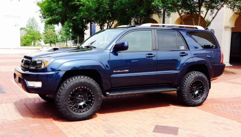 2005 Toyota 4Runner - Blue 2005 Toyota 4Runner with aftermarket wheels and tires.