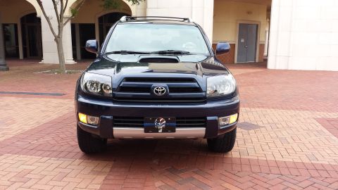 2005 Toyota 4Runner - This SUV is parked on a brick paver surface in front of a building with arched walkways.
