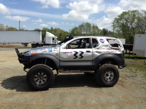 1999 Isuzu Vehicross - This modified 1999 Isuzu Vehicross features off-road tires and racing decals.