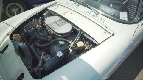 1995 Ford Taurus - White car's engine bay is open, with a 'For Sale' sign visible on the windshield.