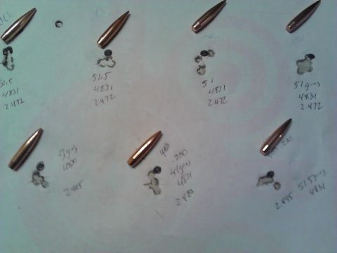 1996 Ford Bronco - Paper showing bullet impacts and cartridges, with handwritten load data.