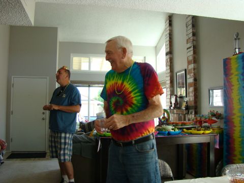1989 Ford Bronco - Two men are at a party with tie-dye decorations.