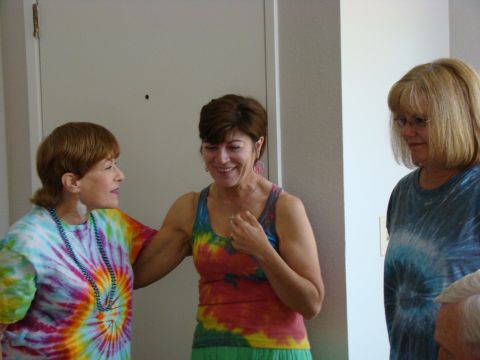 1989 Ford Bronco - Three women in tie-dye shirts are gathered together.