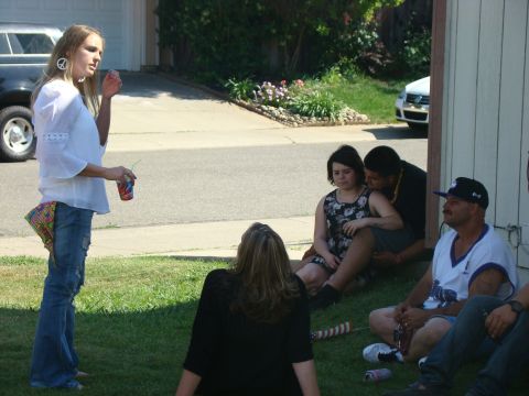 1989 Ford Bronco - A black SUV is visible in the background of a casual outdoor gathering.