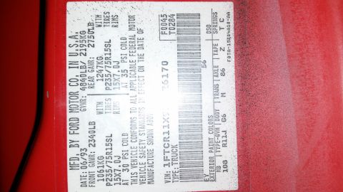 1991 Ford F-250 - Vehicle identification sticker with manufacture date and VIN details.