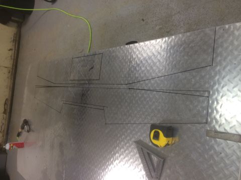 1993 Ford Bronco - Layout for a custom vehicle part is marked on diamond plate metal.
