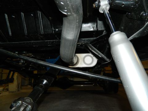 1979 Ford Bronco - Close-up of the undercarriage, showing the exhaust system and suspension components.