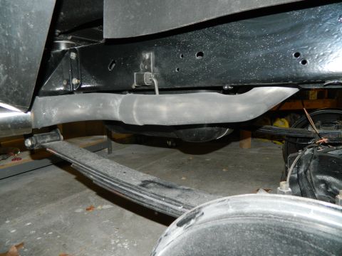 1979 Ford Bronco - The underside of a vehicle is visible, focusing on the exhaust system and suspension components.
