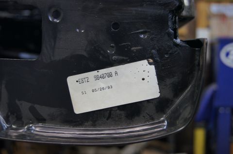 1979 Ford Bronco - A white sticker with part number E8TZ 9840700 A and date 05/26/93 is affixed to a black painted metal component.