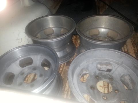 1973 Ford F-100 - Four aluminum wheels are shown in this image.