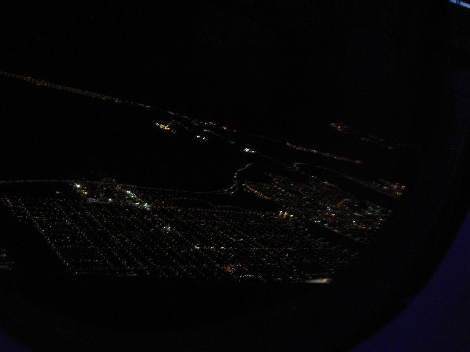 view of city lights from above at night