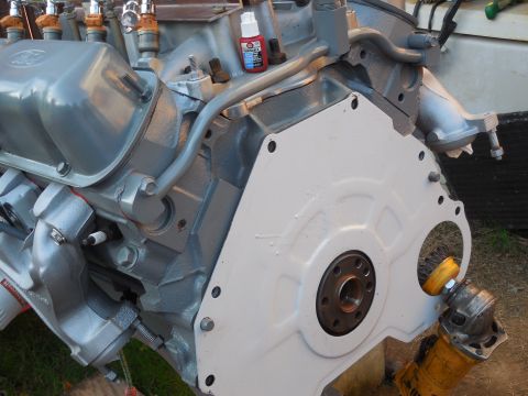 1993 Ford Bronco - The shim plate is Ford IMPLEMENT gray, but it's clean & has a new foam ring, and it's on. After cup-brushing the crank hub clean, the flexp…