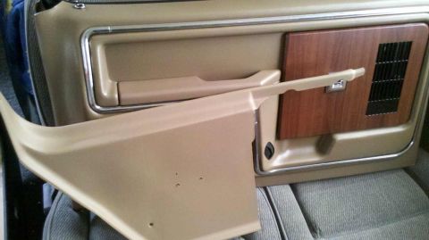 1982 Ford Bronco - Interior door panel and trim pieces from a vehicle, possibly for restoration.