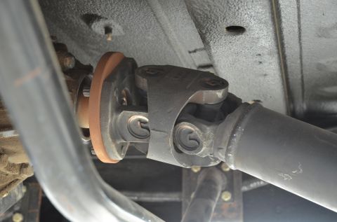 1979 Ford Bronco - Underside view of a vehicle's drive shaft and universal joint, with a SuperMotors watermark visible.