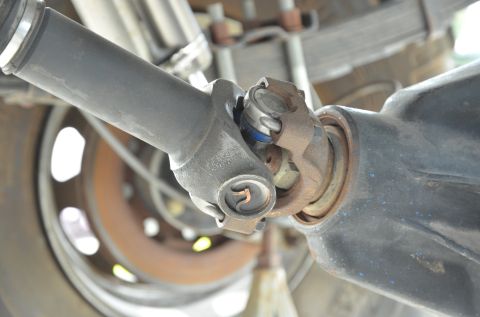 1979 Ford Bronco - Close-up view of a vehicle's drive shaft universal joint and differential housing.