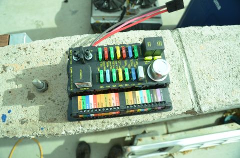 1979 Ford Bronco - A close-up view of a vehicle's electrical fuse box, showing multiple circuits and fuses.