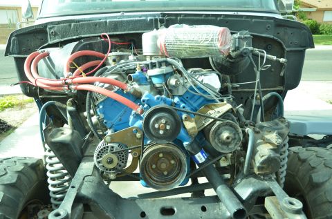 1979 Ford Bronco - Close-up view of a truck's engine compartment, showing the motor and associated components.