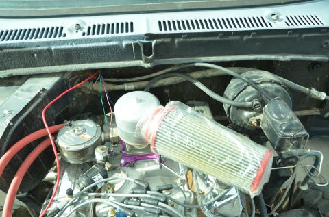 1979 Ford Bronco - Engine bay details with a focus on the carburetor and air intake system.