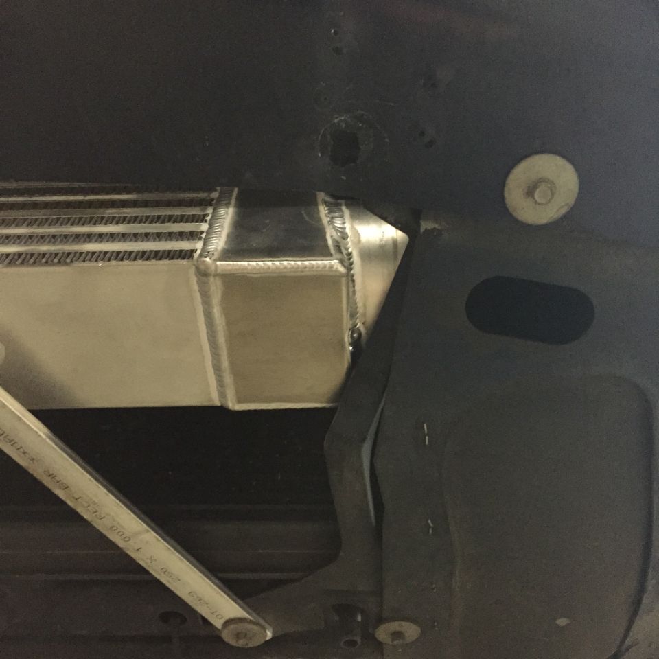 Intercooler and custom bracketry under a vehicle