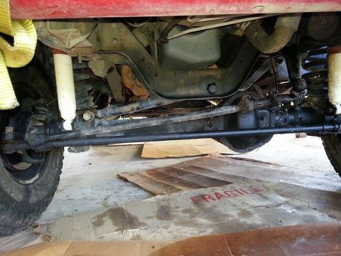 1995 Ford Bronco - Undercarriage view of a 1995 Ford Bronco, showing suspension and steering parts.