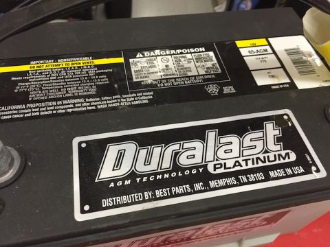 1989 Ford Bronco - Close-up of a Duralast Platinum AGM battery, showing product and safety information.