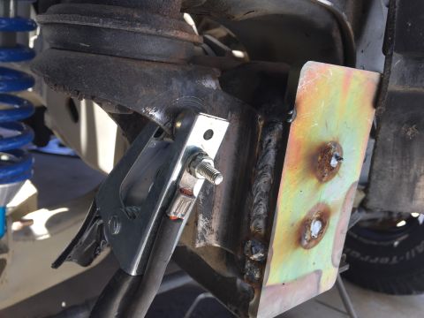1995 Ford Bronco - A clamp is attached to a suspension component, with a SuperMotors logo visible at the bottom right.