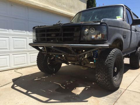 1995 Ford Bronco - This 1995 Ford Bronco features a custom front bumper and modified headlights.
