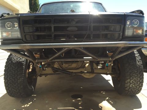1995 Ford Bronco - This truck features a heavy-duty custom bumper and aftermarket headlights.