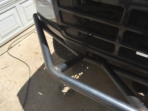 1995 Ford Bronco - Close-up view of the front grille and custom metal bumper on a 1995 Ford Bronco.