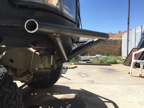 1995 Ford Bronco - Custom rear bumper fabricated with a large exhaust pipe attachment.