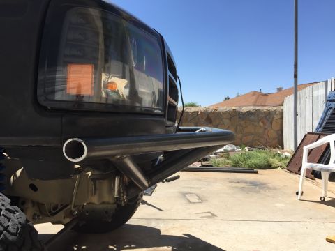 1995 Ford Bronco - A custom bumper is installed on the front of a truck, obscuring much of the vehicle's front end.