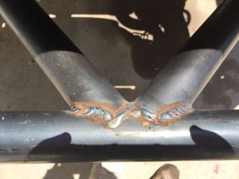 1995 Ford Bronco - This image shows the details of welded metal tubing, with visible weld marks and some surface rust.