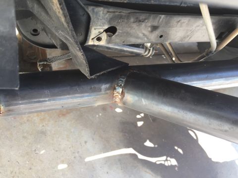 1995 Ford Bronco - Close-up view of the undercarriage shows custom metalwork and suspension components.