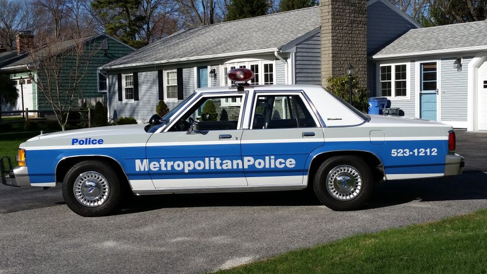 1991 Ford Crown Victoria LTD police car with 'Metropolitan Police' text on door