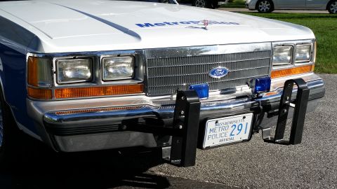 1991 Ford LTD Crown Victoria - Front view of a 1991 Ford Crown Victoria LTD police car, showing the grille, headlights, and push bumper.