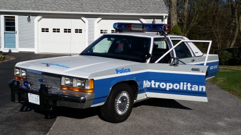 1991 Ford LTD Crown Victoria - This 1991 Ford Crown Victoria LTD police car is shown with its doors open, revealing the interior.