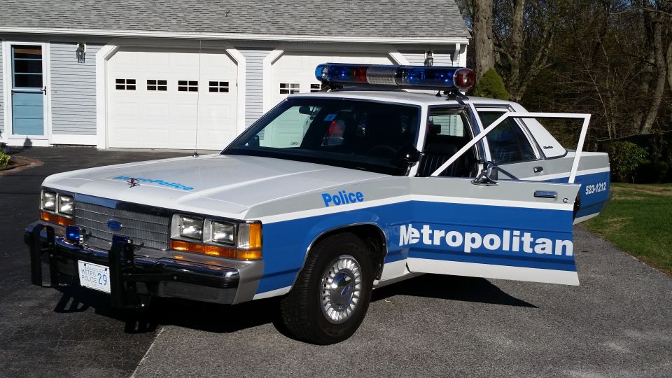 1991 Ford Crown Victoria LTD police car, front 3/4 view, doors open