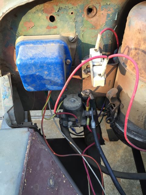 1946 Jeep Willys - Engine electrical components with a blue voltage regulator and starter solenoid are visible in this close-up view.