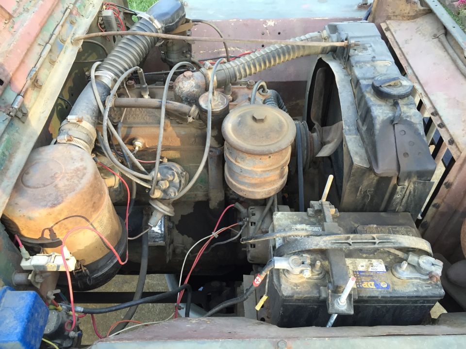 Engine bay with visible battery and radiator
