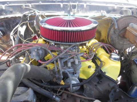 1979 Ford Bronco - Close-up view of an engine bay, showing various components and wiring.