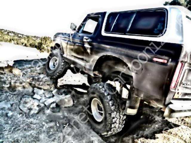1978 Ford Bronco climbing over rocks on a trail