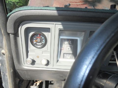 1979 Ford Bronco - Interior view of a 1979 Ford Bronco dashboard, showing gauges and part of the steering wheel.