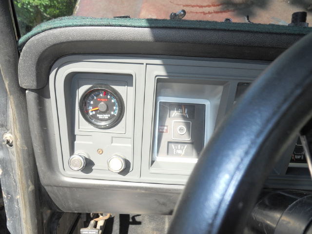 1979 Ford Bronco interior dashboard with gauges and steering wheel