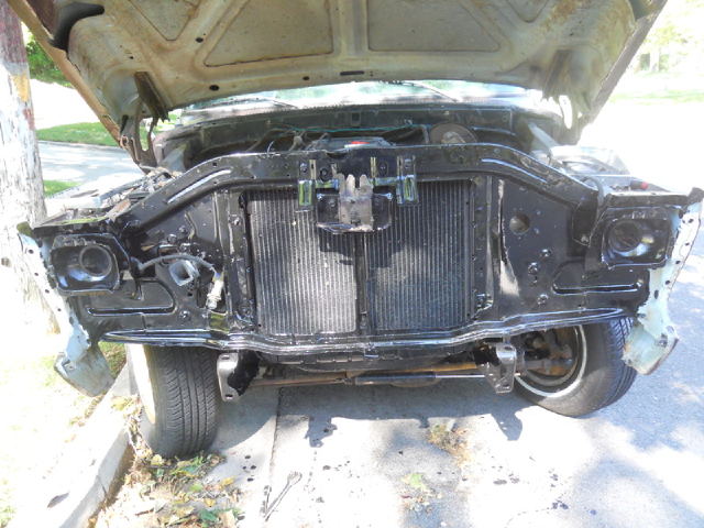 1978 Ford Bronco front end with hood open, showing radiator and grille area