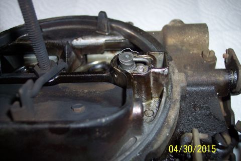 1973 Ford F-250 - Close-up of a carburetor, likely undergoing a rebuild, with visible wear and tear.
